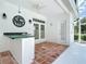 Covered patio with tiled floor, wet bar, ceiling fan, and lighting at 3534 Woodley Park Pl, Oviedo, FL 32765