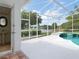 Covered patio overlooking fountain in the lake at 3534 Woodley Park Pl, Oviedo, FL 32765