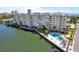 Aerial view of condo community showcasing pool, boat docks, and waterfront location at 3606 S Peninsula Dr # 707, Port Orange, FL 32127
