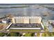 A condo complex with a parking area and direct access to waterfront, with calming lake views in the background at 3606 S Peninsula Dr # 707, Port Orange, FL 32127