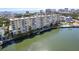 Stunning aerial view of condo community highlighting pool, docks, and coastal charm at 3606 S Peninsula Dr # 707, Port Orange, FL 32127