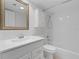 Bright bathroom featuring vanity with white cabinets, framed mirror, and shower-tub combo at 3606 S Peninsula Dr # 707, Port Orange, FL 32127