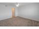Bedroom showcasing neutral colored walls, carpeted floors, ceiling fan, and closet at 3606 S Peninsula Dr # 707, Port Orange, FL 32127