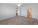 Bedroom with ceiling fan and entryways to other rooms including one to a bathroom at 3606 S Peninsula Dr # 707, Port Orange, FL 32127