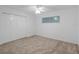 Bedroom showcasing neutral colored walls, carpeted floors, ceiling fan, and closet at 3606 S Peninsula Dr # 707, Port Orange, FL 32127