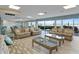 Large clubhouse featuring ample seating, stylish furnishings, and beautiful water views at 3606 S Peninsula Dr # 707, Port Orange, FL 32127
