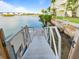 Dock leading to the water with views of the building and the bridge at 3606 S Peninsula Dr # 707, Port Orange, FL 32127