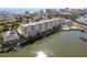 Condominium complex on the water featuring dock, swimming pool, and coastal views at 3606 S Peninsula Dr # 707, Port Orange, FL 32127