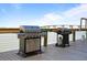 Community grilling area with modern BBQ grills and waterfront views on Tampa Bay at 3606 S Peninsula Dr # 707, Port Orange, FL 32127
