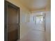 Exterior hallway of unit #707 showing building architecture and lighting at 3606 S Peninsula Dr # 707, Port Orange, FL 32127