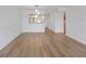 An empty living room space with new wood floors and white walls at 3606 S Peninsula Dr # 707, Port Orange, FL 32127