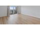 Living room with wood floors and sliding glass doors to the balcony at 3606 S Peninsula Dr # 707, Port Orange, FL 32127