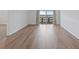 An airy living room with wood floors and a large sliding door to the outside at 3606 S Peninsula Dr # 707, Port Orange, FL 32127
