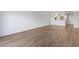 Bright living room featuring wood floors and open access to the kitchen area at 3606 S Peninsula Dr # 707, Port Orange, FL 32127