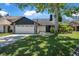 Charming single-Gathering home with a two-car garage, stone accents, and a well-maintained lawn at 3889 Biscayne Dr, Winter Springs, FL 32708