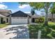 Charming single-Gathering home with a two-car garage, stone accents, and a well-maintained lawn at 3889 Biscayne Dr, Winter Springs, FL 32708
