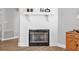 A close up of the fireplace with wooden floors and baseboard at 3889 Biscayne Dr, Winter Springs, FL 32708