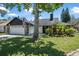 Charming house featuring a well-manicured lawn and an American flag at 3889 Biscayne Dr, Winter Springs, FL 32708