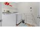 Convenient laundry room with washer, dryer, overhead storage, and drying rack at 3889 Biscayne Dr, Winter Springs, FL 32708