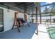Relaxing covered patio area with porch swing and access to screened-in pool at 3889 Biscayne Dr, Winter Springs, FL 32708