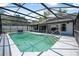 Sparkling screened-in pool with a patio area perfect for relaxing and entertaining at 3889 Biscayne Dr, Winter Springs, FL 32708