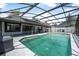 Spacious screened-in pool with ample deck space and surrounding greenery at 3889 Biscayne Dr, Winter Springs, FL 32708