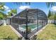 Fully screened pool area with privacy fencing, lush landscaping, and outdoor seating at 3889 Biscayne Dr, Winter Springs, FL 32708