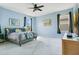 Light-filled bedroom featuring neutral walls, carpet, and furnishings at 4219 Lillian Hall Ln, Orlando, FL 32812