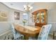 Traditional dining room with a wooden table, china cabinet, and chandelier at 4219 Lillian Hall Ln, Orlando, FL 32812