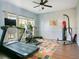 Home gym featuring exercise equipment, a colorful rug and plenty of natural light at 4219 Lillian Hall Ln, Orlando, FL 32812