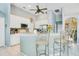 Bright kitchen features white cabinetry, tiled backsplash, and stainless steel appliances at 4219 Lillian Hall Ln, Orlando, FL 32812