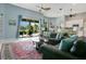 Open-concept living room with a large sliding glass door leading to an outdoor space at 4219 Lillian Hall Ln, Orlando, FL 32812