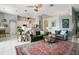 Spacious living area with vaulted ceilings, tile floors, and an open layout leading to the kitchen at 4219 Lillian Hall Ln, Orlando, FL 32812