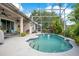 Inviting screened-in pool with patio and seating area, perfect for relaxation and outdoor entertaining at 4219 Lillian Hall Ln, Orlando, FL 32812