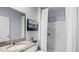 Bathroom features a shower, bathtub, granite countertop vanity and nautical-themed accents at 4622 Barberry Ave, Lakeland, FL 33811