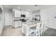 Well-equipped kitchen features an island with barstool seating and modern appliances, perfect for cooking and entertaining at 4622 Barberry Ave, Lakeland, FL 33811