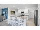 Modern kitchen with granite countertops, stainless steel appliances, and a large island with bar stool seating at 4622 Barberry Ave, Lakeland, FL 33811