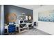 Stylish home office featuring matching dual desks, gray accent wall, nautical decor, and coastal accents at 4622 Barberry Ave, Lakeland, FL 33811