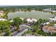 Condo building with ample parking surrounded by mature trees, offering serene lake views at 516 Orange Dr # 22, Altamonte Springs, FL 32701