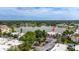 Aerial view of lakeside condos with ample parking, surrounded by trees and reflecting lake views at 516 Orange Dr # 22, Altamonte Springs, FL 32701