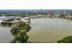 Aerial view of the community, showcasing a lake and well-maintained grounds at 516 Orange Dr # 22, Altamonte Springs, FL 32701