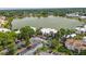 Condo building with ample parking surrounded by mature trees, offering serene lake views at 516 Orange Dr # 22, Altamonte Springs, FL 32701