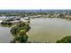 Stunning aerial view of lakeside condos surrounded by lush greenery, and featuring lake views at 516 Orange Dr # 22, Altamonte Springs, FL 32701