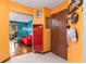 Bright entryway showcasing colorful walls, unique decor, and hardwood floors leading to a cozy living area at 516 Orange Dr # 22, Altamonte Springs, FL 32701