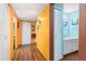 Hallway with multiple closets and access to the bathroom, featuring bright yellow walls at 516 Orange Dr # 22, Altamonte Springs, FL 32701