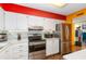 Well-equipped kitchen with white cabinets, modern stainless steel appliances, and granite countertops at 516 Orange Dr # 22, Altamonte Springs, FL 32701