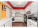 Well-equipped kitchen with white cabinets, modern appliances, and a stylish backsplash for a functional cooking space at 516 Orange Dr # 22, Altamonte Springs, FL 32701