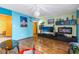 Bright living room with hard floors, entertainment center, and large window providing natural light at 516 Orange Dr # 22, Altamonte Springs, FL 32701