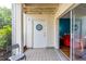 Private outdoor patio with access to living room, featuring a white storage door and serene outdoor views at 516 Orange Dr # 22, Altamonte Springs, FL 32701