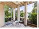 Enclosed porch with tile flooring, offering a peaceful retreat with views of the surrounding greenery at 516 Orange Dr # 22, Altamonte Springs, FL 32701